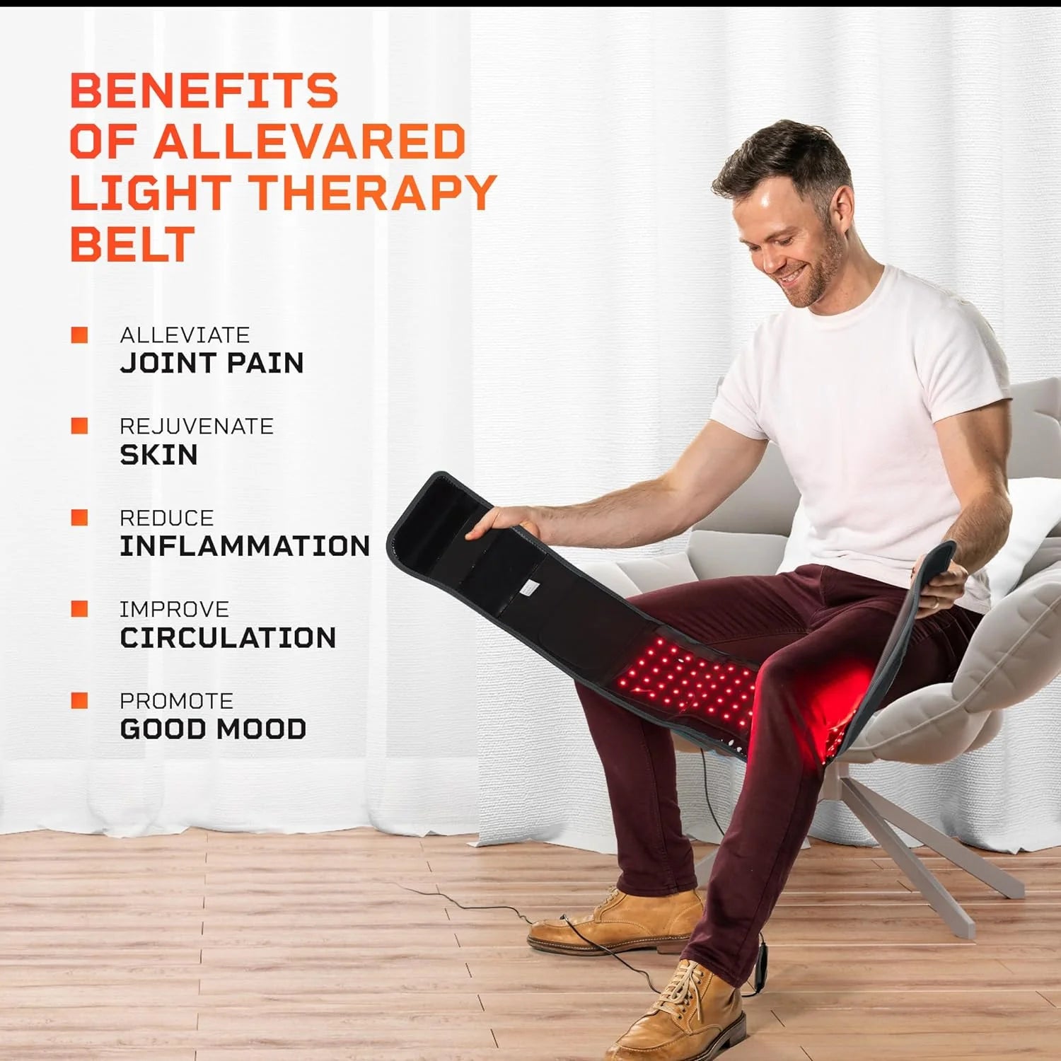 A man wrapping a red light therapy belt around his leg